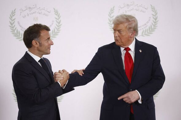 French President Emmanuel Macron (L) and US President Donald Trump (R) shake hands during the greetings ceremony at the Gaza Pea