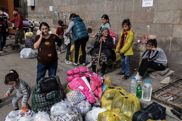 Armenian refugees from Nagorno-Karabakh are seen in the center of the town of Goris on Sept. 30, 2023, before being evacuated to various Armenian cities. Over 100,000 people fled Nagorno-Karabakh since the breakaway region saw its decades-long fight against Azerbaijani rule end in sudden defeat.