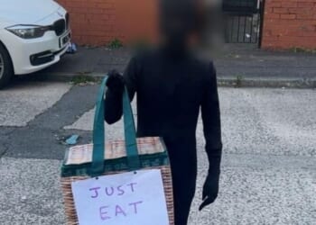 Halloween racism row erupts after British schoolboy dressed up as Just Eat delivery driver in black bodysuit