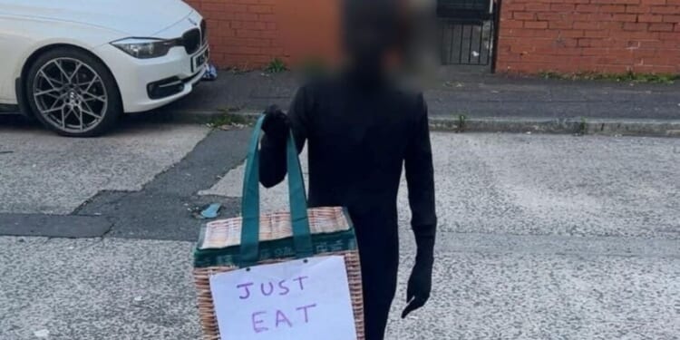 Halloween racism row erupts after British schoolboy dressed up as Just Eat delivery driver in black bodysuit
