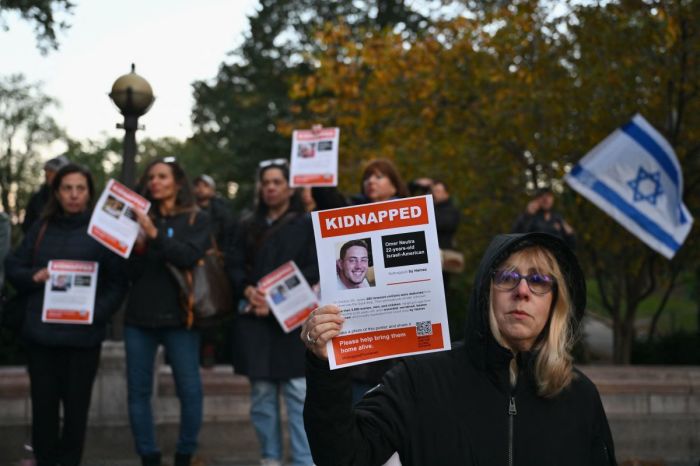 A woman holds a poster of Israeli hostage Omer Neutra during a memorial vigil for the Israeli people killed by Hamas during the Oct. 7 attacks, in New York City on Nov. 1, 2023. 