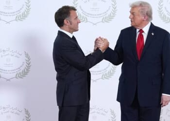 Lip reader decodes Trump’s five-word threat to Macron in gripping handshake | US | News