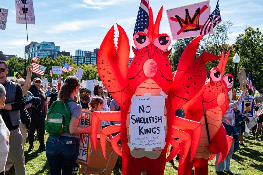 People participate in a "No Kings" national day of protest in Boston, Massachusetts, on October 18, 2025. From New York to San Francisco, millions of Americans are expected to hit the streets to voice their anger over President Donald Trump's policies at nationwide "No Kings" protests. (Photo by Joseph Prezioso / AFP) (Photo by JOSEPH PREZIOSO/AFP via Getty Images)