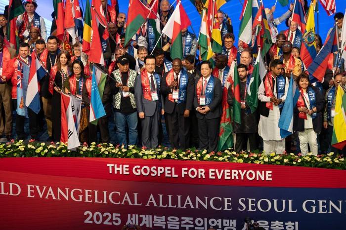 Participants at the World Evangelical Alliance General Assembly carry 124 flags representing their nations on the first day of the event in Seoul, South Korea, on Oct. 27, 2025.