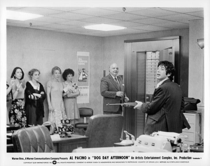 Penny Allen (3rd from left) and others are held up by Al Pacino in a scene from the film 'Dog Day Afternoon', 1975. (Photo by Warner Brothers/Getty Images)