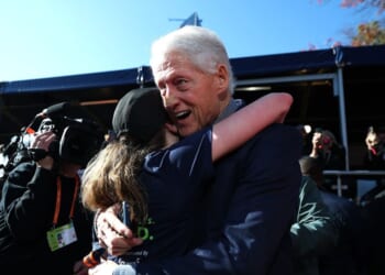 Bill Clinton seen sporting mysterious face bandage as he greets daughter Chelsea