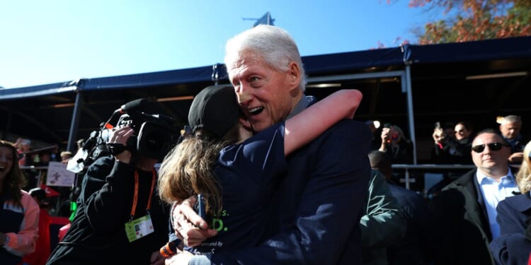 Bill Clinton seen sporting mysterious face bandage as he greets daughter Chelsea