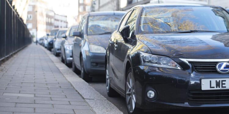Neighbour row erupts after loved up couple leave bizarre note on homeowner's car 'not to park between us'