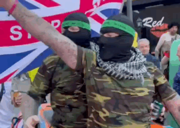 'Stop the Boats' themed parade takes over Benidorm as Britons dress up in Hamas outfits
