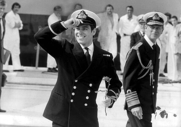 Man in naval uniform holds rose and smiles Man in naval uniform holds rose and smiles