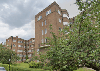 Neighbour row erupts as local residents in leafy West London suburb left fuming after landlord starts building luxury flats on TOP of their homes
