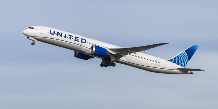 Heathrow flight forced to divert and land after laptop slips down side of seat