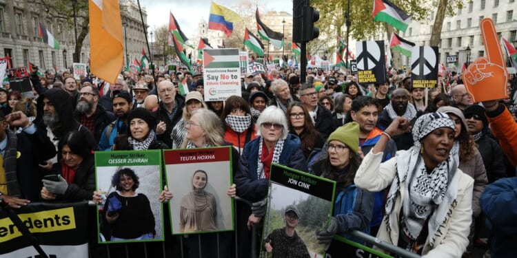 Police make dozens of arrests at protests across Britain