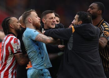 Championship match ends in complete chaos with huge brawl as fans held back by security