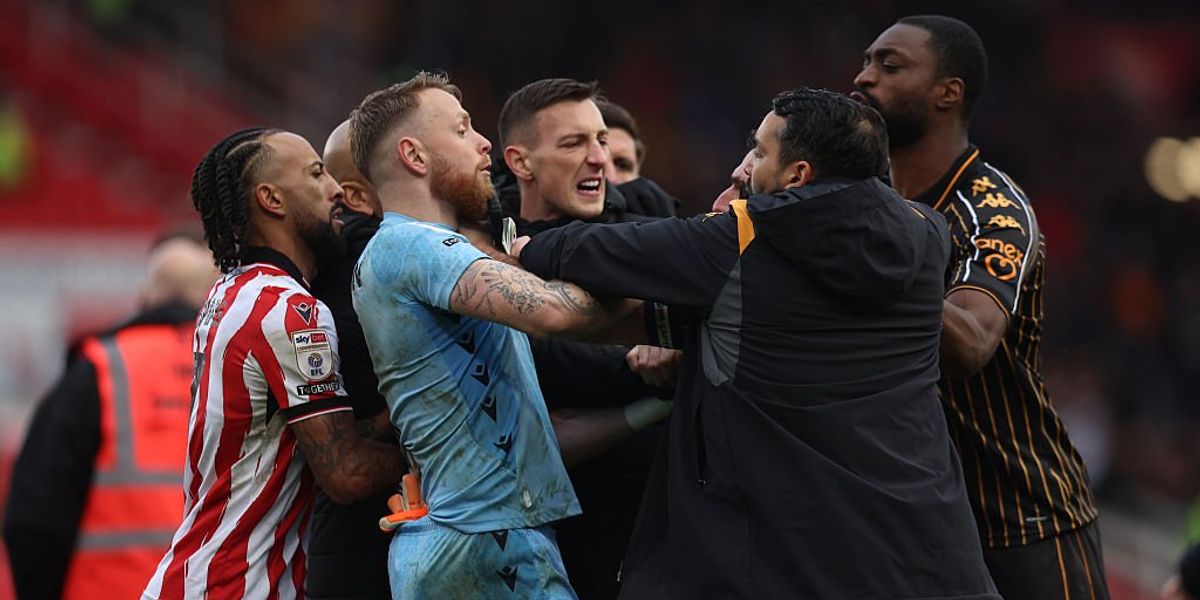 Championship match ends in complete chaos with huge brawl as fans held back by security