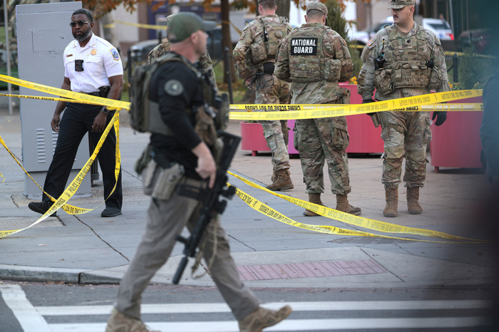 Members of law enforcement and National Guard soldiers respond to a shooting near the White House on Nov. 26, 2025, in Washington, D.C. At least two National Guard soldiers have been shot blocks from the White House.