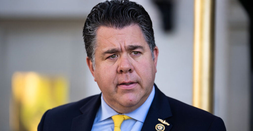 Congressman Nick LaLota leaves the capitol hill club wearing a suit and tie.