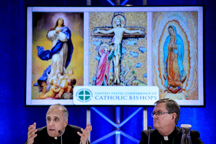 Indiana Bishop Timothy Doherty, chairman of the committee for the Protection of Children and Young People, listens while Galveston-Houston Cardinal Daniel DiNardo, president of the USCCB General Assembly, speaks during a press conference at the annual U.S. Conference of Catholic Bishops on Nov. 12, 2018, in Baltimore, Maryland.