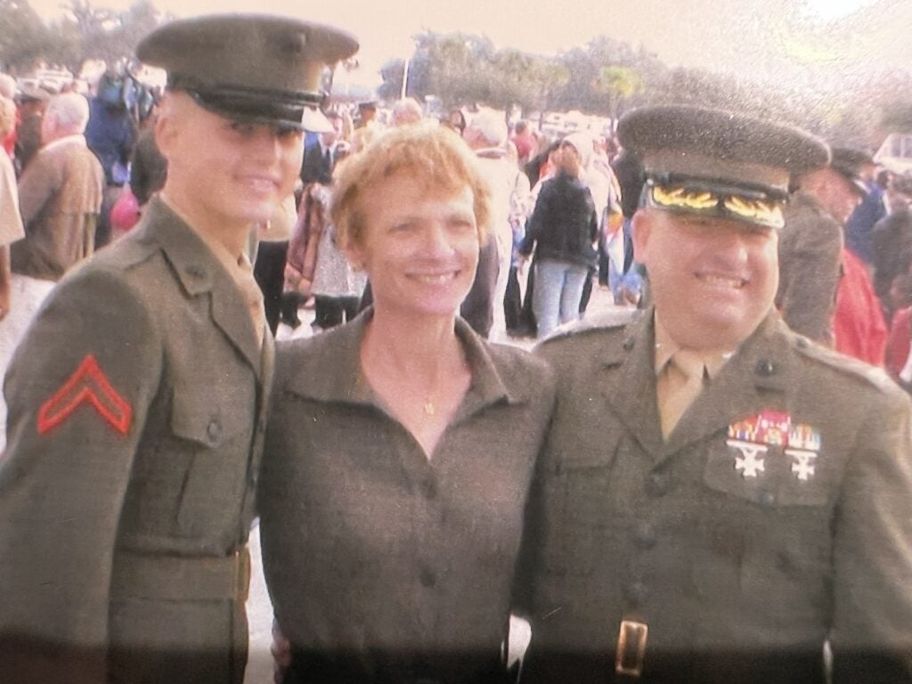 Thomas Harris in his Marine uniform with his mother and father, who is also in uniform.
