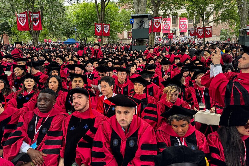 TOPSHOT - Graduates gather as they attend commencement ceremony at Harvard University in Cambridge, Massachusetts, on May 29, 2025. US President Donald Trump is furious at Harvard for rejecting his administration's push for oversight on admissions and hiring, amid the president's claims the school is a hotbed of anti-Semitism and "woke" liberal ideology. (Photo by Rick Friedman / AFP) (Photo by RICK FRIEDMAN/AFP via Getty Images)