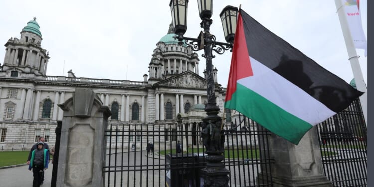 Palestine flag hoisted outside UK city hall as police forced to swoop in