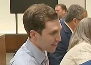 Charlie Kirk's suspected killer smirks during first court appearance as mother drowns in tears