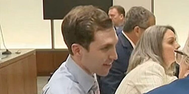 Charlie Kirk's suspected killer smirks during first court appearance as mother drowns in tears