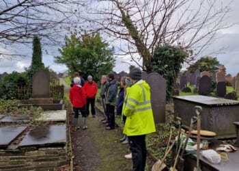 Refugees and asylum-seekers plant bluebells in Welsh churchyard to encourage friendship