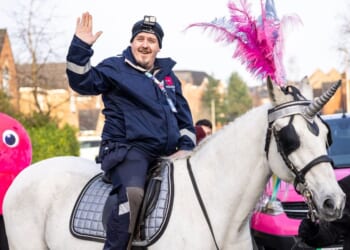 Octopus Energy celebrates major milestone with unicorn and brass band in customer's home