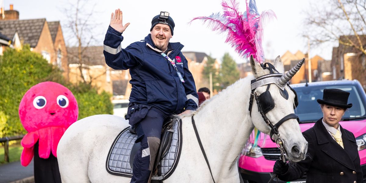 Octopus Energy celebrates major milestone with unicorn and brass band in customer's home