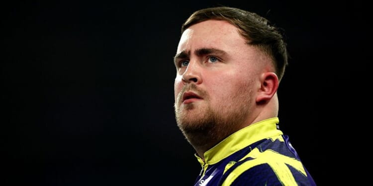 Luke Littler cruises into World Darts Championship third round after straight-sets win over NHS worker David Davies