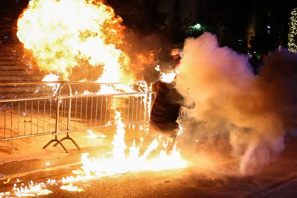 \u200bA supporter of the opposition is burned by a Molotov cocktail
