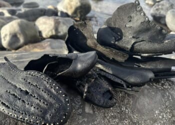 Mystery as dozens of Victorian shoes wash up on British beach