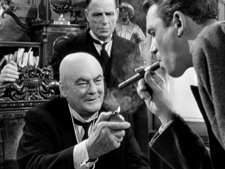 LOS ANGELES - DECEMBER 20: The movie "It's a Wonderful Life", produced and directed by Frank Capra. Seen here from left, Lionel Barrymore as Henry F. Potter, Frank Hagney (in background) as Potter's Bodyguard and James Stewart as George Bailey. Premiered December 20, 1946; theatrical wide release January 7, 1947. Screen capture. Paramount Pictures. (Photo by CBS via Getty Images)