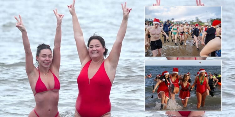 Brave Britons dive into sea before temperatures plunge below freezing