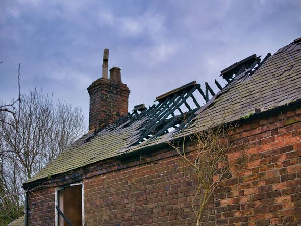The burned roof of an abandoned farmhouse in Flintshire, North Wales, UK. Taken in winter with an ov