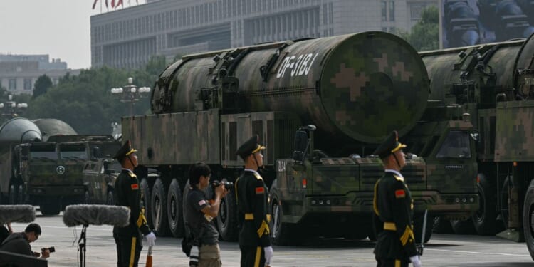 Beijing readies more than 100 long-range nuclear missiles in key launch sites before firing rockets directly at Taiwan