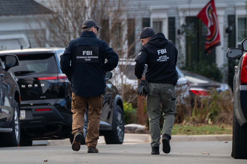FBI agents gather in front of the home of suspected Jan. 6, 2021, pipe bomber on Dec. 4, 2025, in Woodbridge, Virginia. Federal agents have arrested a suspect identified as Brian Cole they are alleging placed two pipe bombs, which never exploded, the night before the Jan. 6, 2021, U.S. Capitol attack. 
