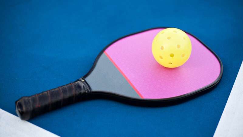 Pickle ball and paddle | ID 46520760 © Ahturner | Dreamstime.com