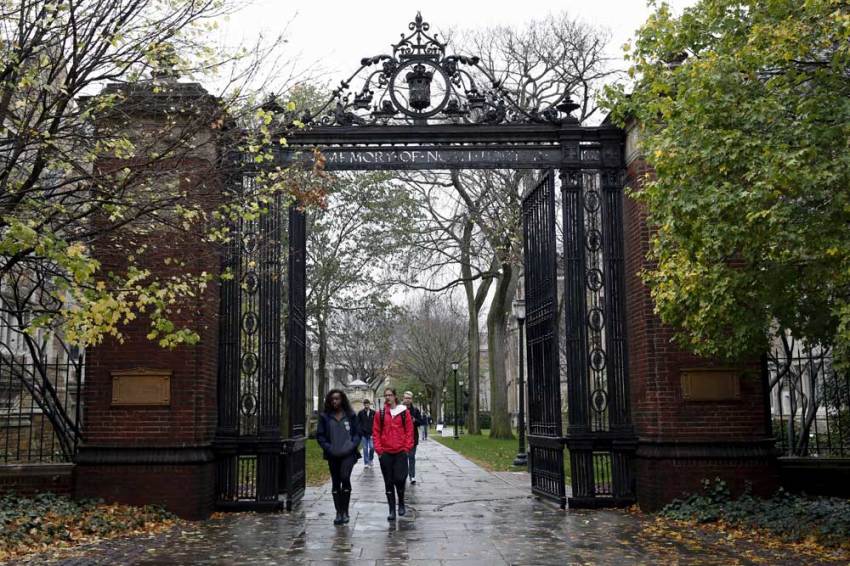 Students walk on the campus of Yale University in New Haven, Connecticut.