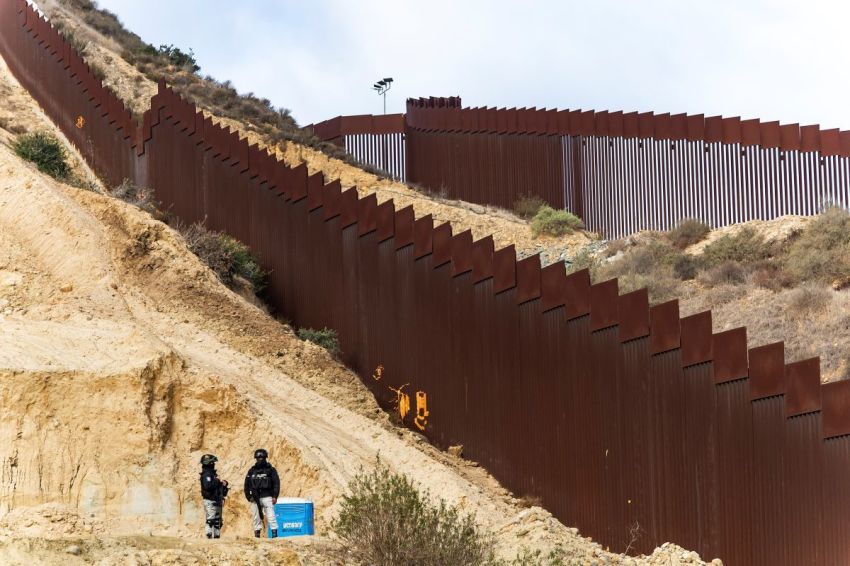 National Guard officers monitor the border wall between Mexico and the U.S. during the deployment of National Guard troops at the U.S. Border on Feb. 5, 2025, in Tijuana, Mexico. Mexican President Claudia Sheinbaum announced the deployment of 10,000 troops along the Mexico-U.S. border as part of an agreement with Trump's administration to delay an increase of 25% tariffs on exported goods.