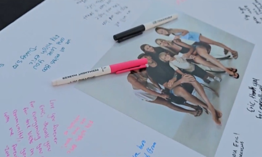 Friends and family signed a poster board following the death of Pastor Eric John Williams on Oct. 20, 2025, in Huntington Beach, California.