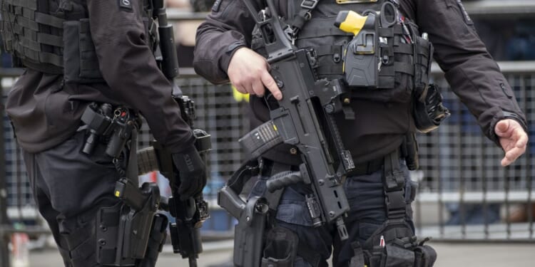 Driver shot dead by police after 'fleeing two-car crash brandishing handgun'