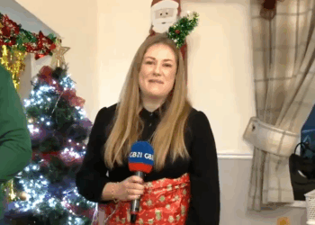GB News reporter wrapped up as a Christmas gift at Veterans Christmas party -WATCH