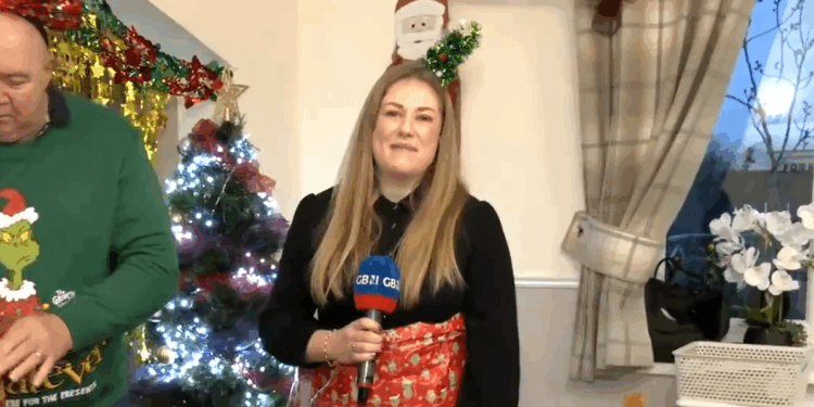 GB News reporter wrapped up as a Christmas gift at Veterans Christmas party -WATCH