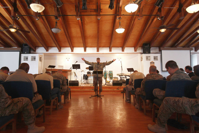 Protestant U.S. Army chaplain Brian Chepey leads prayers on Sept. 11, 2011, at Bagram Air Field, Afghanistan. Ten years after the 9/11 attacks in the United States and after almost a decade war in Afghanistan, American soldiers gathered for church services in prayer and solemn observance of the tragic day. 