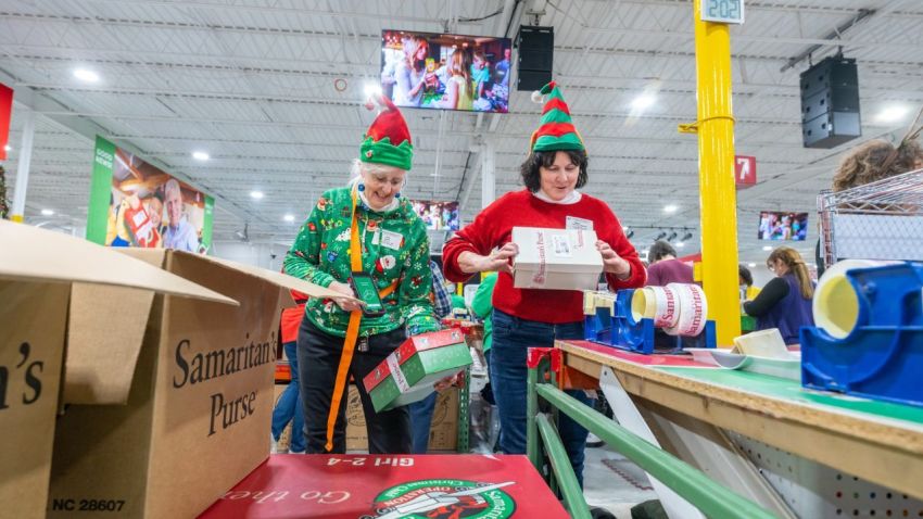 Volunteers with the Samaritan's Purse project, Operation Christmas Child, package shoeboxes on Dec. 12, 2025, at the organization's new Mid-Atlantic Ministry Center in Windsor Mill, Maryland.