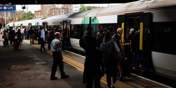 Surrey trains LIVE: London services disrupted between Clapham and Woking after 'emergency' | UK | News