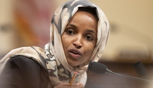 Tim Walz and Ilhan Omar Caught Posing in Damning Photos with Illegal Somali Fraudster – RedState