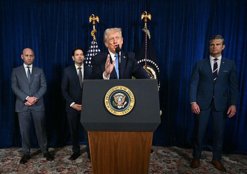 TOPSHOT - US President Donald Trump, alongside (L/R) Deputy Chief of Staff Stephen Miller, Secretary of State Marco Rubio, and US Secretary of Defense Pete Hegseth, speaks to the press following US military actions in Venezuela, at his Mar-a-Lago residence in Palm Beach, Florida, on January 3, 2026. President Trump said Saturday that US forces had captured Venezuelan leader Nicolas Maduro after launching a "large scale strike" on the South American country. (Photo by Jim WATSON / AFP via Getty Images)